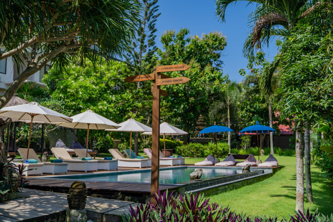 Peaceful swimming pool in tropical garden setting at Uluwatu resort